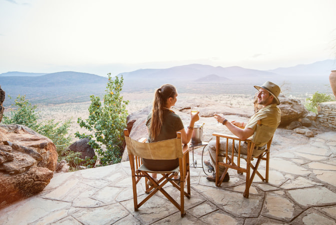 Couple enjoying a romantic sunset during a luxury honeymoon safari in Tanzania