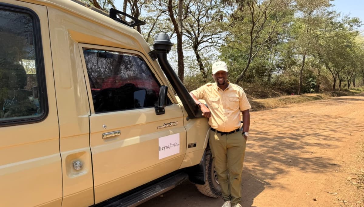 Experienced local Tanzanian safari guide leading guests on a private wildlife safari